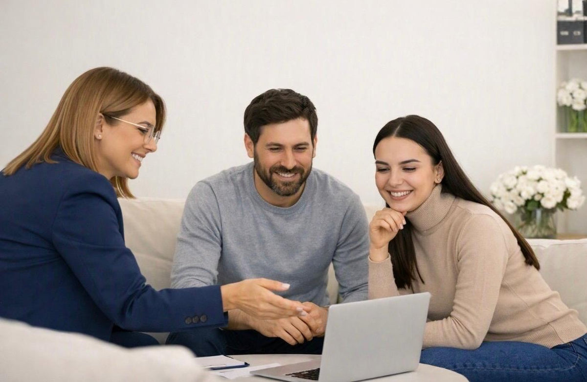 A Lewis Medix coordinator reviews options with a couple on a laptop