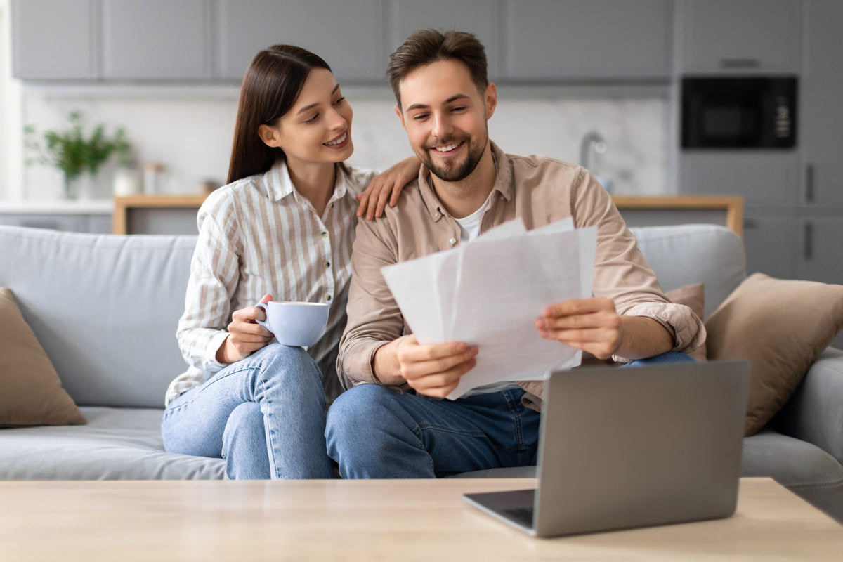 A couple reviewing their plan and quote at home